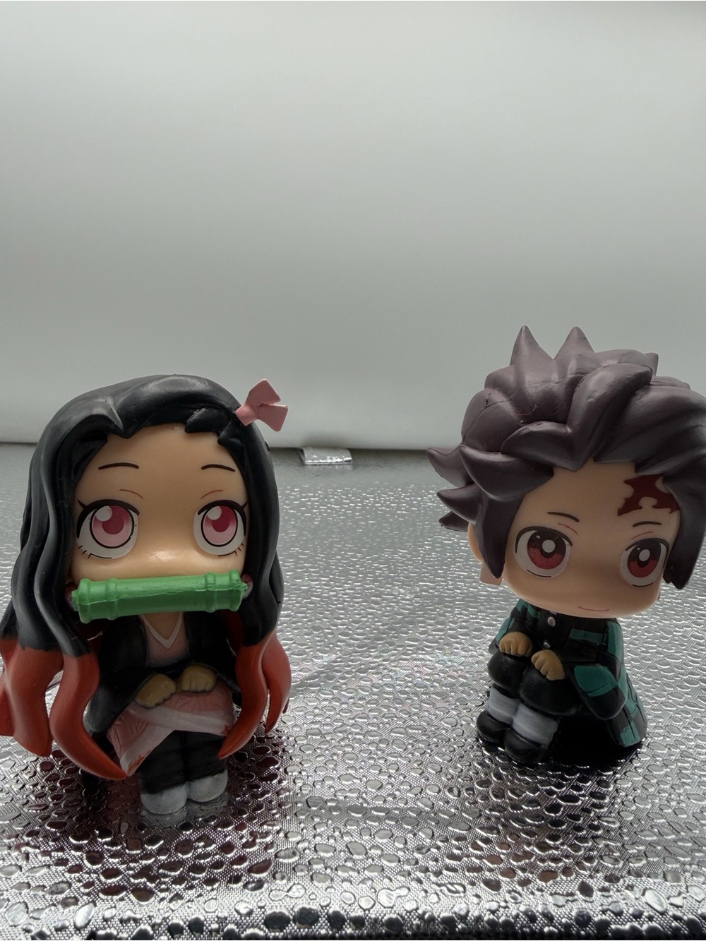 Anime-Inspired Pink & Black Chibi Figure Set with Green Accessory